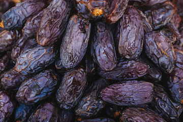 Heap of dried dates close-up.