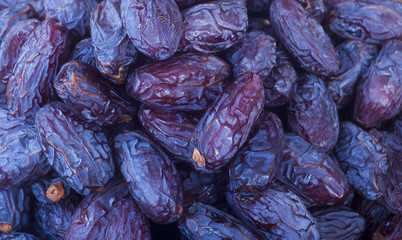 Heap of dried dates close-up.