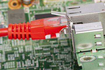 Network switch and ethernet cables, close up macro shot on computer circuit board