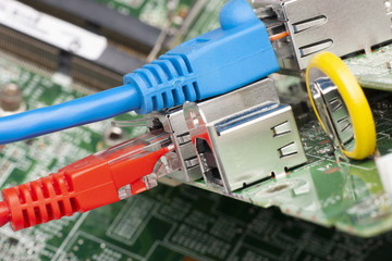 Network switch and ethernet cables, close up macro shot on computer circuit board