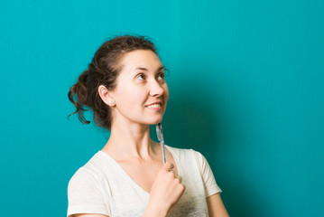 Fototapeta premium beautiful thoughtful brunette girl with pen