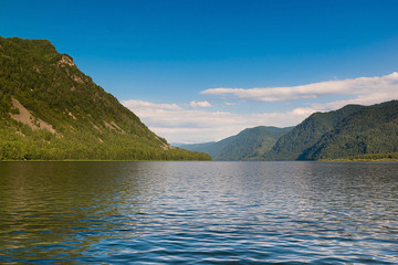 Teletskoe lake smooth water and mountains of the reserve