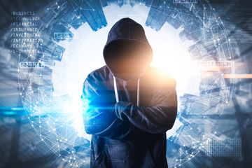 The abstract image of the hacker standing overlay with futuristic hologram and the future cityscape is backdrop. the concept of cyber attack, virus, malware, illegally and cyber security.