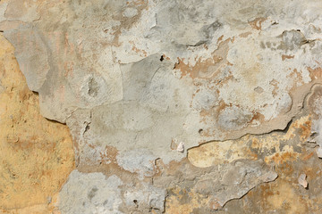 Obraz na płótnie Canvas texture of old peeling yellow plaster