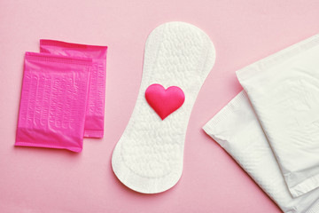 women intimate hygiene products, different sanitary pads  on pink background