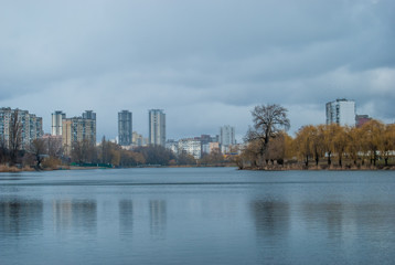Fototapeta premium View of multi-storey houses from the lake