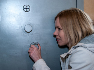 Woman tries to pick up the code to the safe
