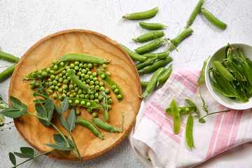 Green pea pods on plate