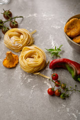 Raw pasta and forest mushrooms