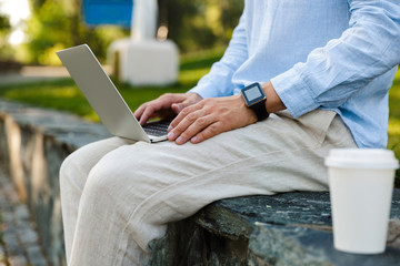 Close up of a man working on laptop computer