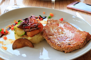 plate of tuna steak and its vegetable garnish in a french restaurant
