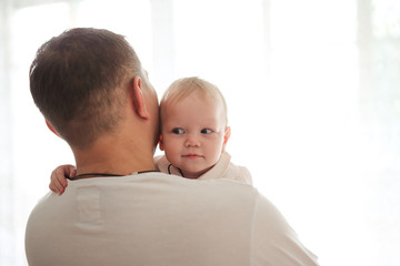 Father and his daughter child playing together