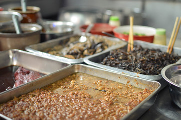A market stall full of ingredients for Chinese traditional noodles. Jalan Petaling, Kuala Lumpur, Malaysia