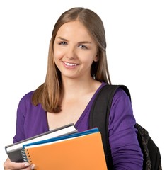 Portrait of a Smiling Student with Backpack and Notebook