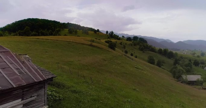 Aerial view of rural landscape on a rainy day with overcast sky.