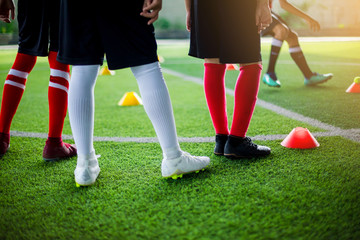 Obraz premium Kid soccer team learning and Standing with coach