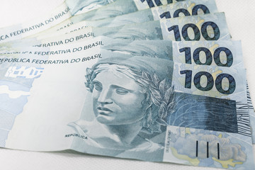 Real hundred notes. Brazilian money. Selective focus. Brazilian currency. Economy, inflation, business. Front side. 100.