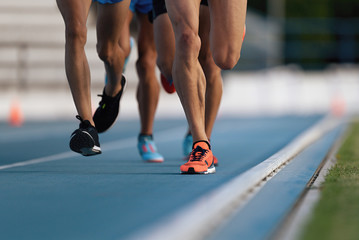 Athletics people running on the track field, race on track and field competitions