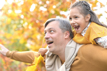 Fototapeta premium Portrait of father and daughter in park