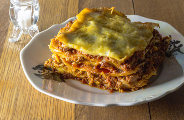 Lasagne serving on dinner plate - Slice of lasagna meat pasta close up
