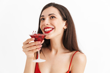 Excited woman posing isolated drinking cocktail.