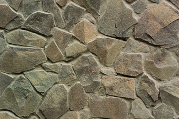 Photo of wall texture from decorative stones on cement mortar