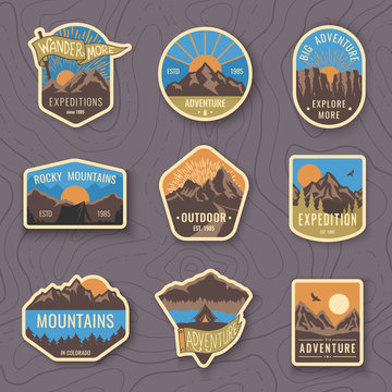 Set of nine mountain travel emblems. Camping outdoor adventure emblems, badges and logo patches. Mountain tourism, hiking. Forest camp labels in vintage style