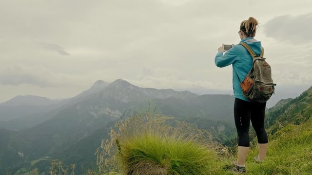 Woman hiker on top of mountain