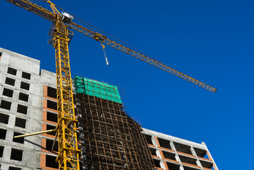 tower crane at the construction site of a residential building