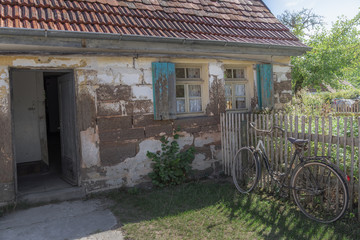 Abandoned old house with bike and garden