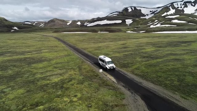 120 fps Iceland Aerial view of Landmanalaugar river crossing by super jeep truck