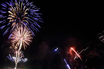 Abstract colored firework background with free space for text. Celebration and anniversary concept. Diwali, 4th july, new year.