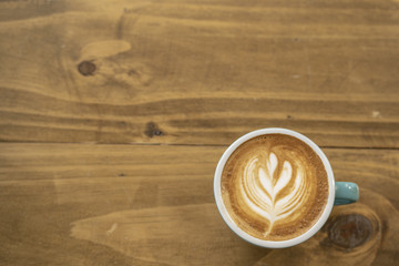 Cappuccino cup with lacquer art on wooden floor  Beautiful Foam, Ceramic Cup, Modern Color, Place for Message