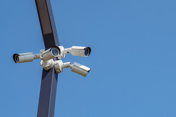 Multi-angle CCTV surveillance security camera video equipment on the blue sky background