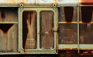 metal door of old and rusty bogie train