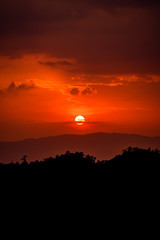 Beautiful sun silhouette at sunset mountain village in Chiang Mai