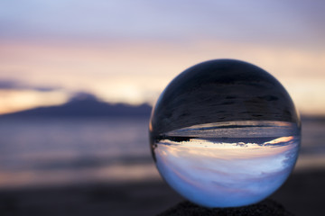 Beautiful Pink Sunset Seascape Captured in Glass Ball
