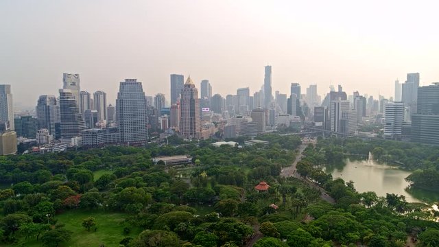 Thailand Bangkok Aerial v75 Picturesque panning view of Lumphini Park and cityscape 3/18