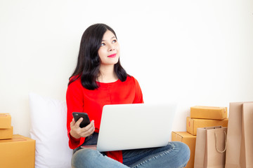 Women using a laptop computer to sell a products online.  Concept of ecommerce in digital and modern life style.