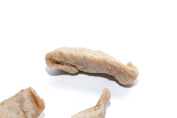 close up of raw fish ball on white background