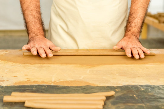 Man working with clay in a studio