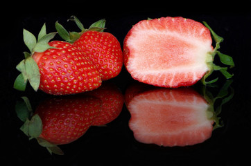 Cut strawberries in reflection