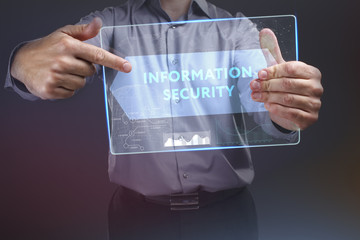 The concept of business, technology, the Internet and the network. A young entrepreneur working on a virtual screen of the future and sees the inscription: Information security