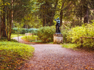 Statue in the summer park. Vintage toned. Saint-Petersburg, Russia