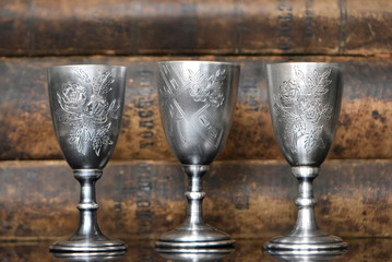 Silver glasses on the background of old books 
