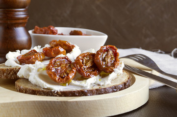sun-dried tomatoes with soft cheese. Italian appetizer.