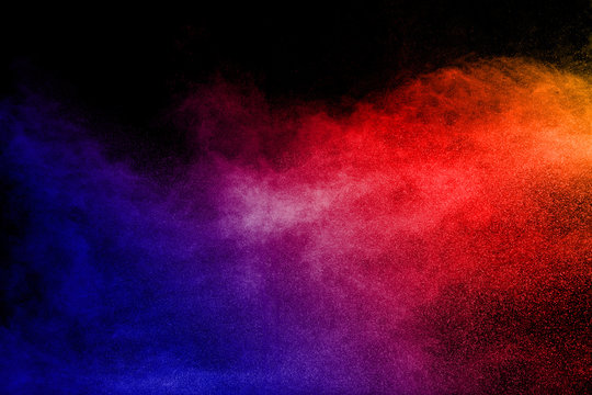 Multi color powder explosion  on black background.