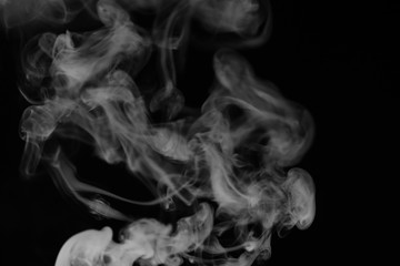 White smoke on a black background. Texture of smoke. Clubs of wh