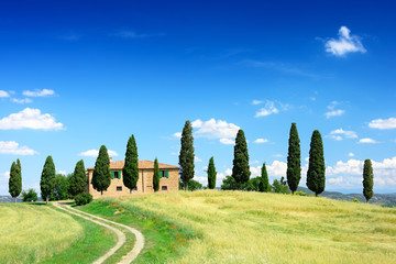 Idyllic view, typical Tuscany farmhouse among fields