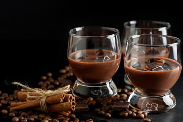 glasses of cream coffee cocktail or chocolate martini on black background
